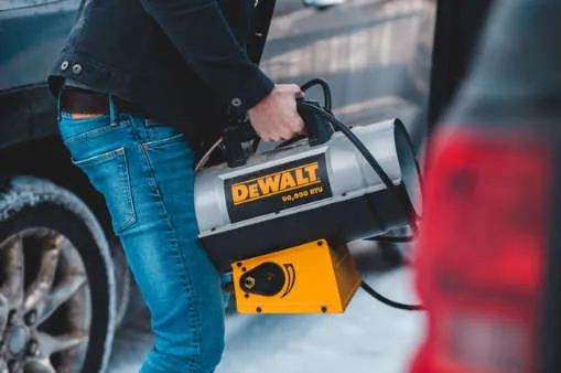 picture of someone holding a portable propane heater