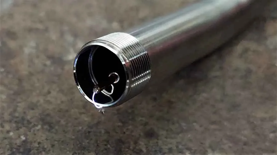 A working ignition wire creating a spark between the wire and burn tube wall. If you do not see this when clicking the starter, try moving the wire closer or farther away.